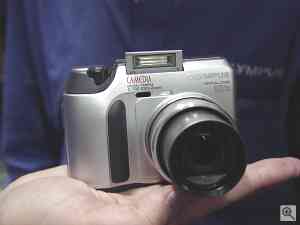 Olympus' Camedia C-700 UltraZoom digital camera,  front view. Copyright (c) 2001, The Imaging Resource.  All rights reserved. Click for a bigger picture!
