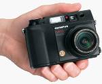 Olympus' Camedia C-4040 Zoom digital camera, shown in-hand for scale. Courtesy of Olympus.