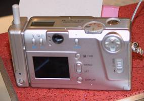 Canon's PowerShot S10 digital camera with Bluetooth module attached. Copyright (c) 2001, LetsGoDigital.nl. Used by permission.