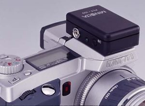 Minolta's PCT-100 Flash Adapter, shown mounted on a DiMAGE 5/7 series camera body. Courtesy of Minolta, with modifications by Michael R. Tomkins.