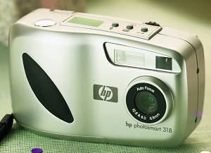 Hewlett Packard's PhotoSmart 318 digital camera. Courtesy of Hewlett Packard, with modifications by Michael R. Tomkins. Click for a bigger picture!