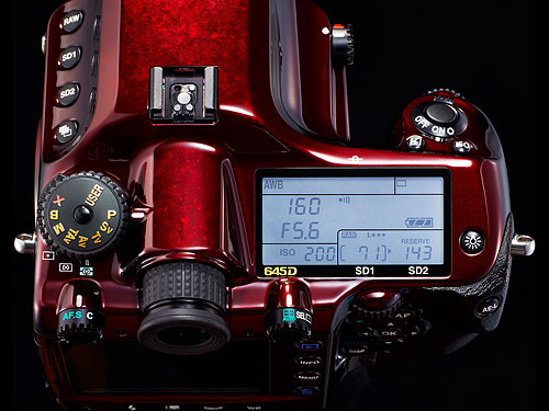 The Pentax 645D Japan has gold-plated mode dial indications, as well as a white backlight for the top-panel display. Photo provided by Pentax Imaging Co. Click for a bigger picture!