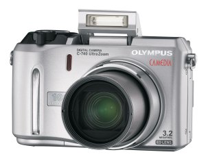 Olympus' C-740 Ultra Zoom digital camera. Courtesy of Olympus, with modifications by Michael R. Tomkins. Click for a bigger picture!