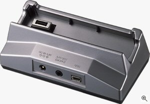 Olympus' Camedia AZ-1 digital camera cradle. Courtesy of Olympus, with modifications by Michael R. Tomkins. Click for a bigger picture!
