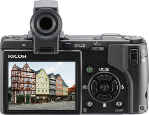 Ricoh's Caplio GX100 digital camera. Courtesy of Ricoh, with modifications by Michael R. Tomkins. Click for a bigger picture!