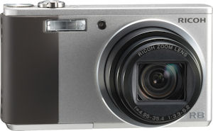 Ricoh's Caplio R8 digital camera. Courtesy of Ricoh, with modifications by Michael R. Tomkins. Click for a bigger picture!