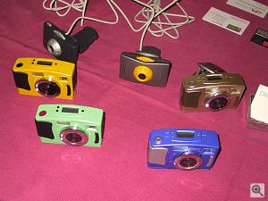Chicony's TC800 digital camera in several colors. Copyright (c) 2000, Michael R. Tomkins, all rights reserved. Click for a bigger picture!