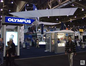 Olympus' booth. Copyright &copy; 2001, Michael R. Tomkins. All rights reserved. Click for a bigger picture!