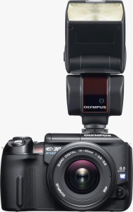 Olympus' EVOLT E-300 digital SLR. Courtesy of Olympus, with modifications by Michael R. Tomkins. Click for a bigger picture!