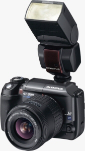 Olympus' EVOLT E-300 digital SLR. Courtesy of Olympus, with modifications by Michael R. Tomkins. Click for a bigger picture!