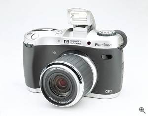 Hewlett-Packard's PhotoSmart 912 digital camera, front left quarter view. Courtesy of Hewlett Packard - click for a bigger picture!