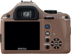 The chocolate version of the Pentax K-x digital SLR with 18-55mm kit lens. Photo provided by Pentax Imaging Co. Click for a bigger picture!