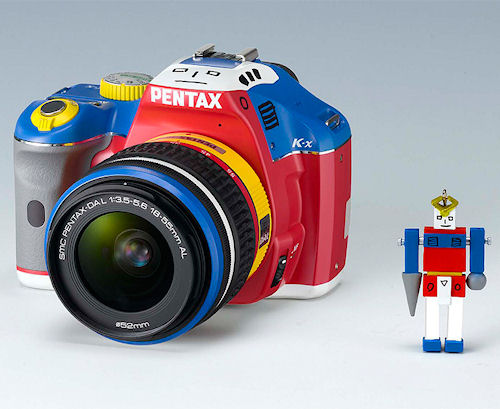 The Pentax K-x Korejanai Robot Model digital SLR with matching lens, shown alongside a Korejanai robot. Photo provided by Hoya Corp. Click for a bigger picture!