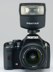 Pentax's K2000 digital SLR. Courtesy of Pentax, with modifications by Michael R. Tomkins. Click for a bigger picture!