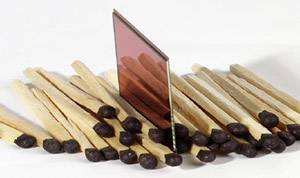 CreoScitex's Leaf C-Most 6.6 megapixel CMOS image sensor, shown amidst a pile of matchsticks for scale. Courtesy of CreoScitex.