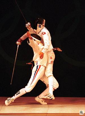 France's Hughes Obry and Switzerland's Marcel Fischer show that Olympic fencing is nothing if not dramatic! Courtesy of Sport the Library / Jason Childs / NewsDX - click for a bigger picture!