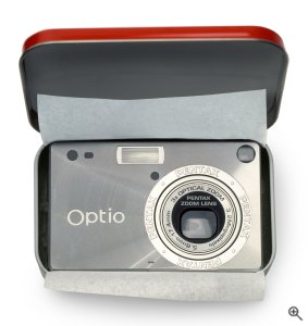 Pentax's OptioS digital camera. Courtesy of Pentax, with modifications by Michael R. Tomkins. Click for a bigger picture!