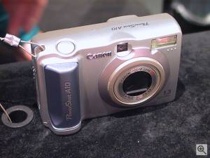 Canon's PowerShot A10 digital camera, front right  quarter view. Copyright (c) 2001, Michael R. Tomkins, all rights reserved. Click for a bigger picture!