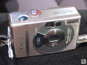 Canon's PowerShot S300 Digital ELPH digital  camera, front right quarter view. Copyright (c) 2001, Michael R. Tomkins, all rights reserved. Click for a bigger picture!
