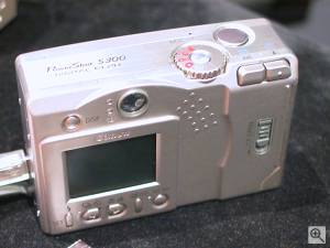 Canon's PowerShot S300 Digital ELPH digital  camera, rear left quarter view. Copyright (c) 2001, Michael R. Tomkins, all rights reserved. Click for a bigger picture!