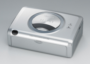 Canon's SELPHY CP600 dye sublimation photo printer. Courtesy of Canon, with modifications by Michael R. Tomkins. Click for a bigger picture!