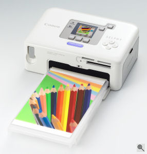 Canon's SELPHY CP720 digital camera. Courtesy of Canon, with modifications by Michael R. Tomkins. Click for a bigger picture!