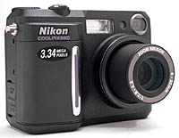 Nikon's Coolpix 880 digital camera, front right quarter view. Copyright (c) 2000, The Imaging Resource, all rights reserved.