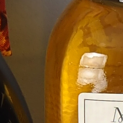 100% crop from Olympus E-M1X test image taken at ISO 64