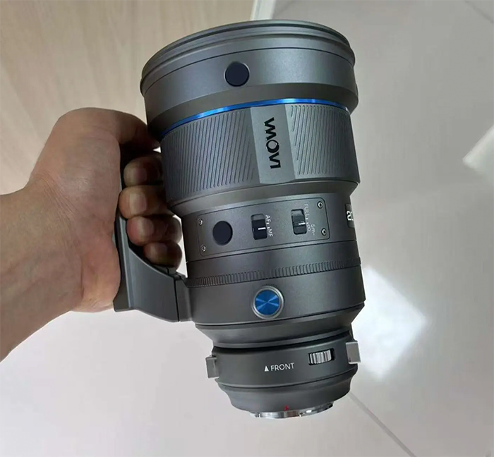 Leaked image of the laowa 200mm f2 held by a person vertically