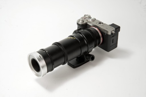 Product image for the new, affordable Mitakon 55mm f/2.8 lens mounted on a camera